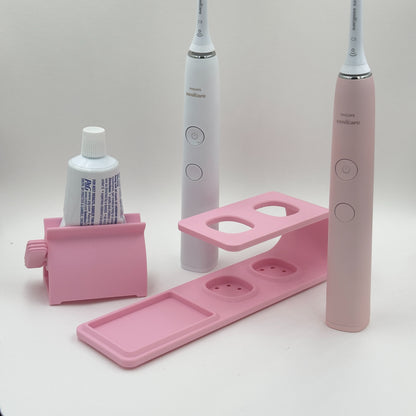 Suport pentru doua periute Philips Sonicare Roz cu dispozitiv de stoarcere a pastei de dinti