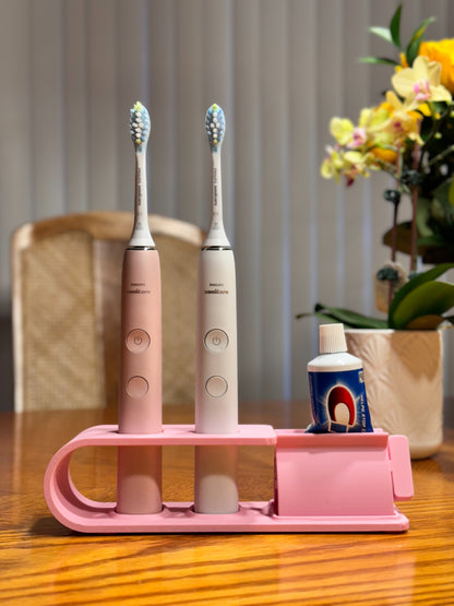 Suport pentru doua periute Philips Sonicare Roz cu dispozitiv de stoarcere a pastei de dinti
